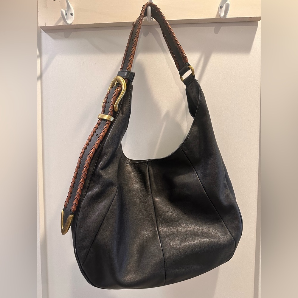 Frye black shoulder bag with brown leather accent on strap.
